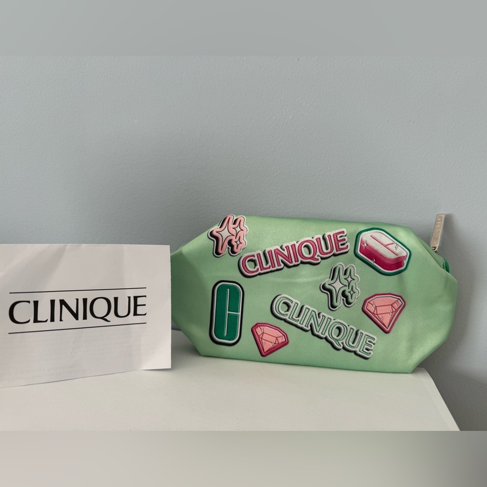 Clinique cosmetics makeup travel bag NWT Satin green with graphic design